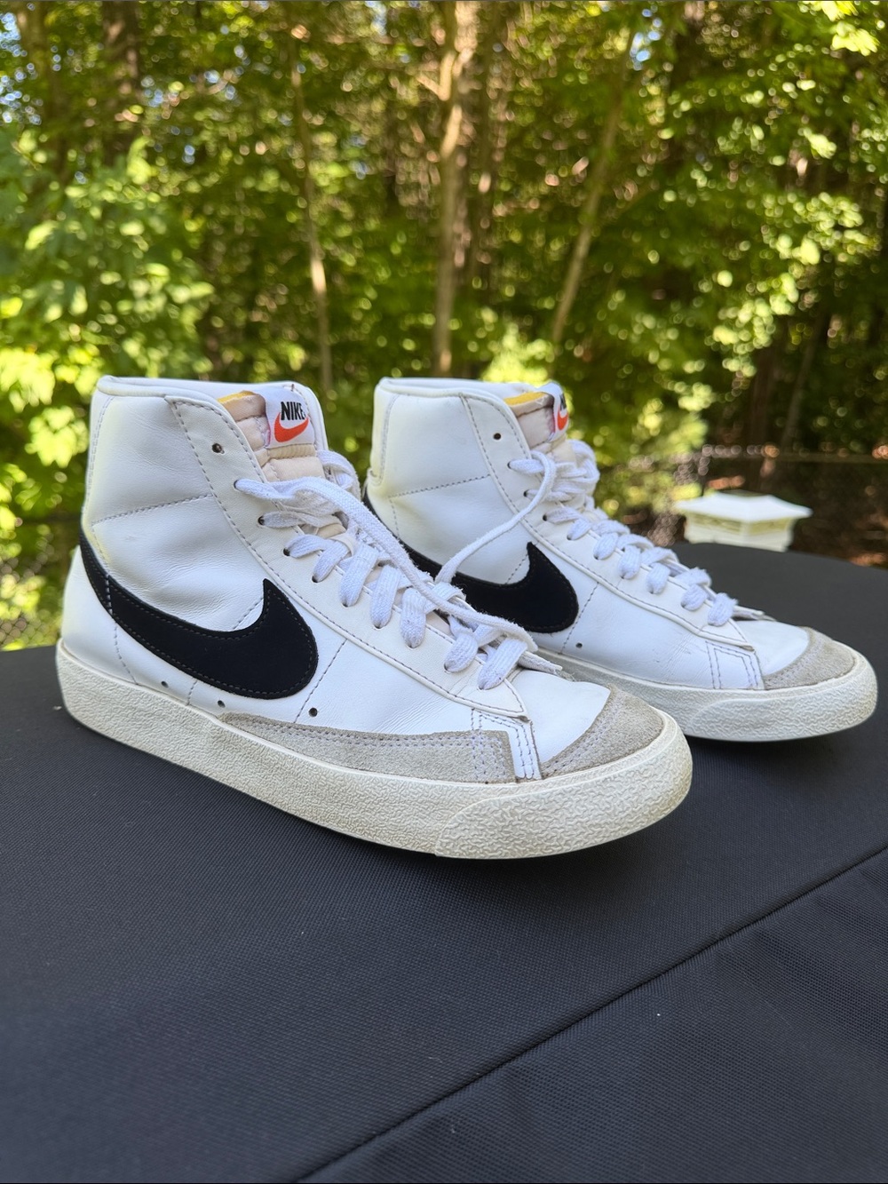 Nike White High-Top Sneakers with Black Swoosh